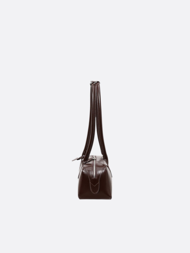 Elongated leather shoulder bag <br>Sésame