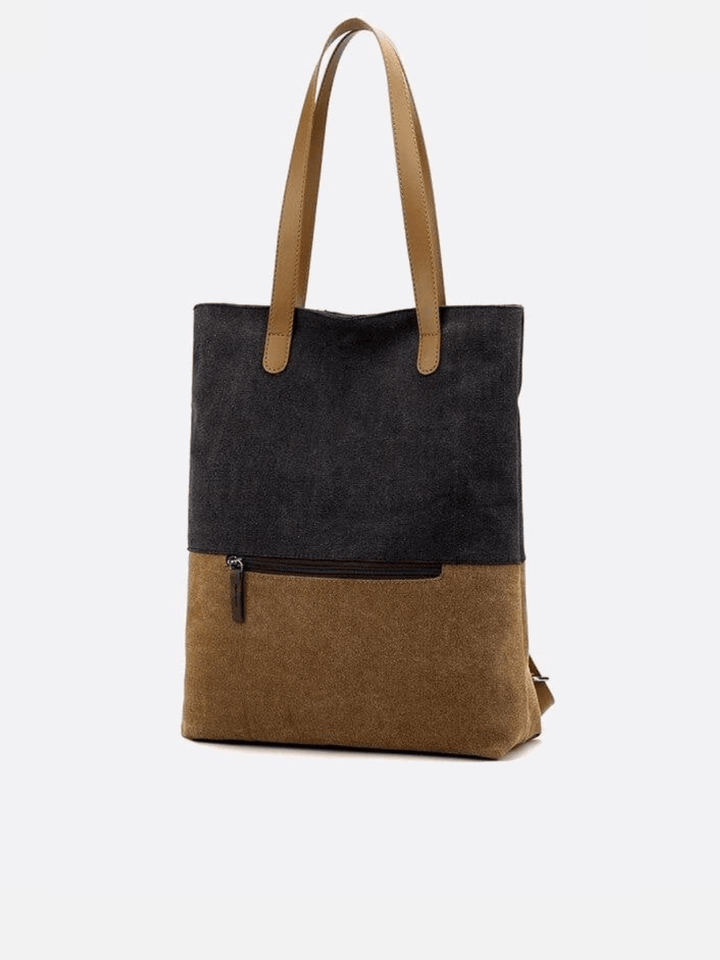 Sac noir toile porté épaule et dos