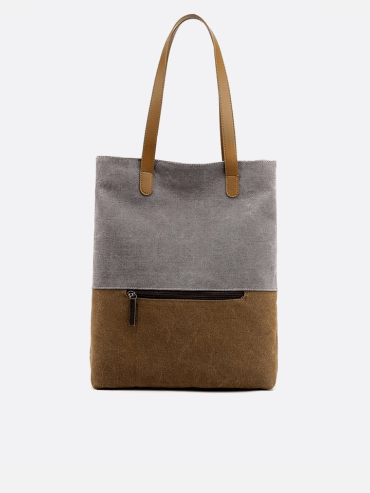 Sac toile gris porté épaule et dos