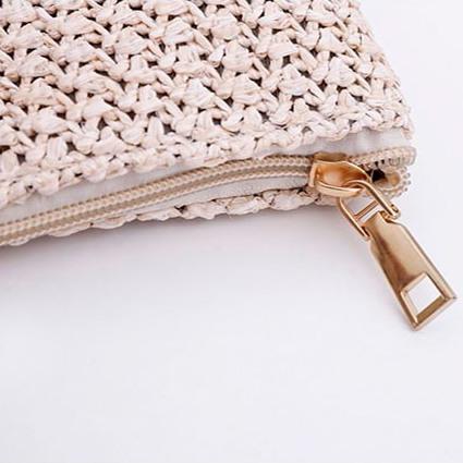 Straw tote bag with pompom and leather handle
