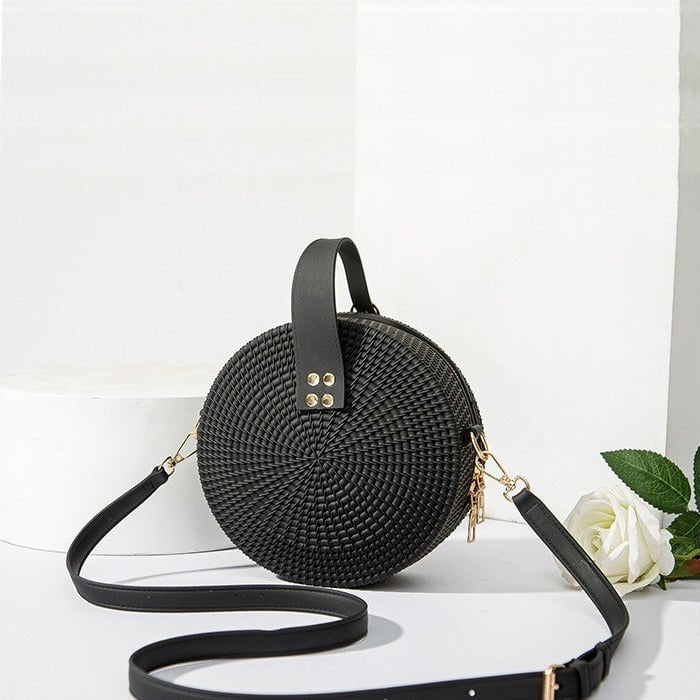 Round braided effect leather handbag